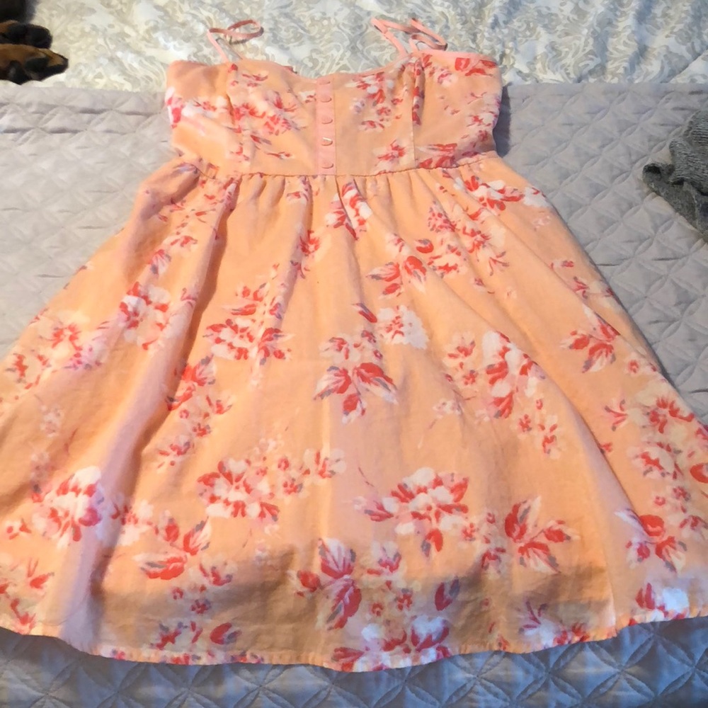 Short strappy summer dress with pockets.